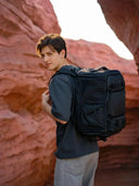 photographer with camera bag