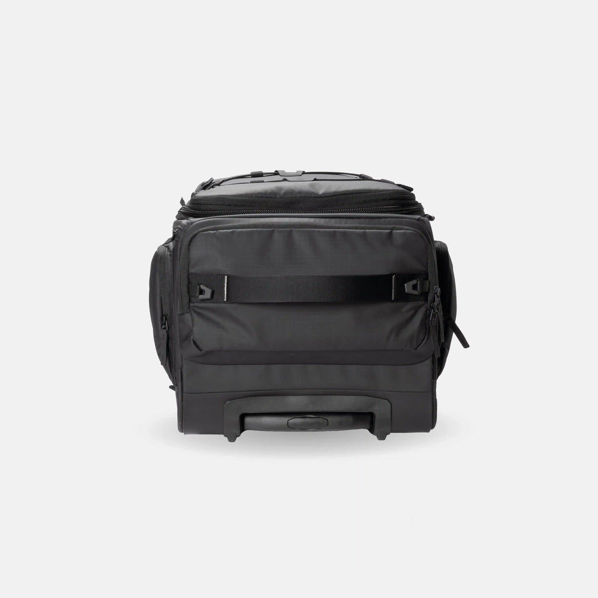 A black rolling duffel bag with a telescoping handle, side pockets, and a top zip closure, photographed against a light gray studio background.