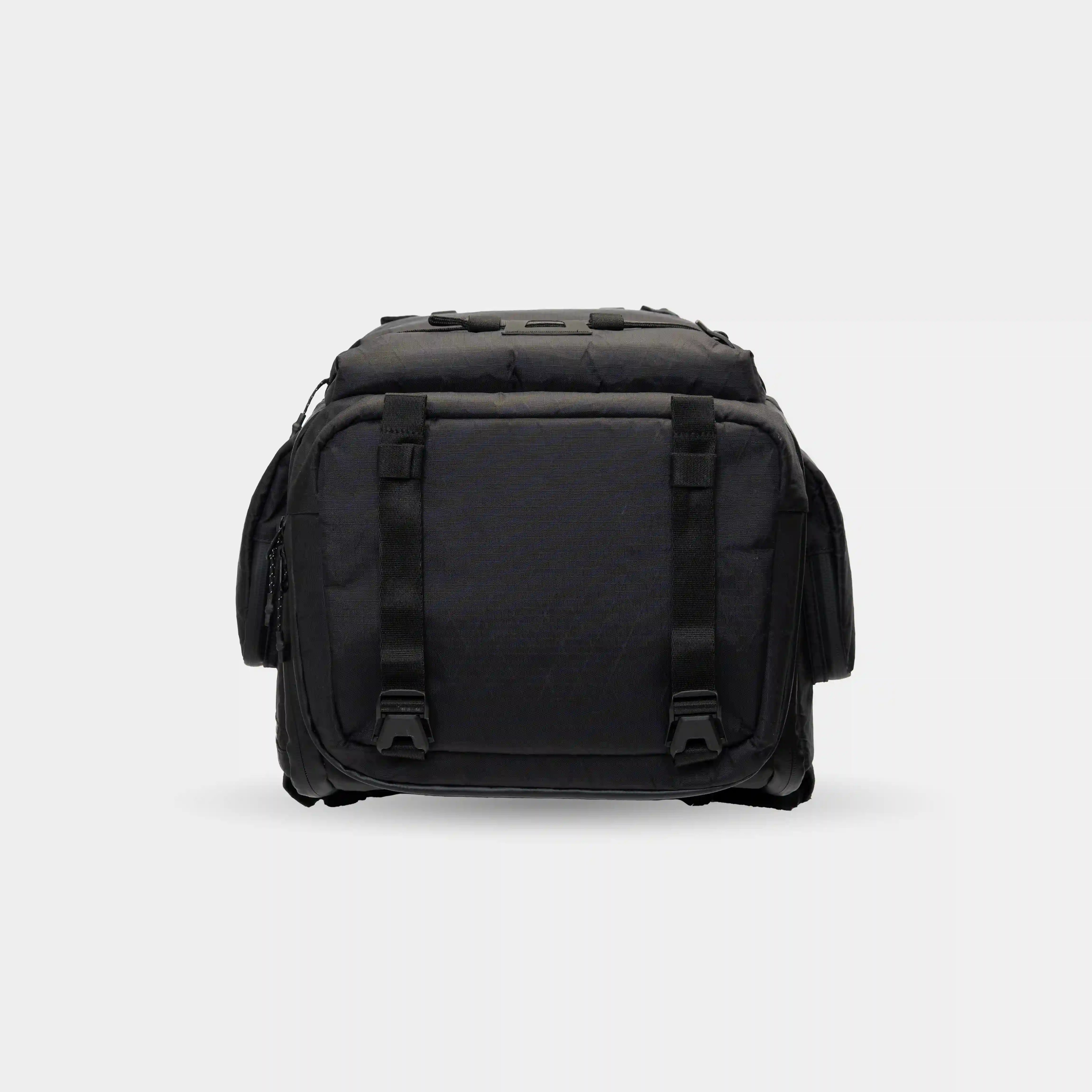 Waterproof camera backpack with padded compartments. Fits cinema cameras, laptop, tripod, and personal items for long shoots.