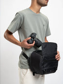 Lightweight camera sling for street shoots or drone setups. Waterproof with secure pockets.