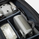 Organized sling bag with front, back, and interior compartments.