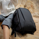 Travel 28L camera backpack for creators carrying cameras, laptop, and clothing.