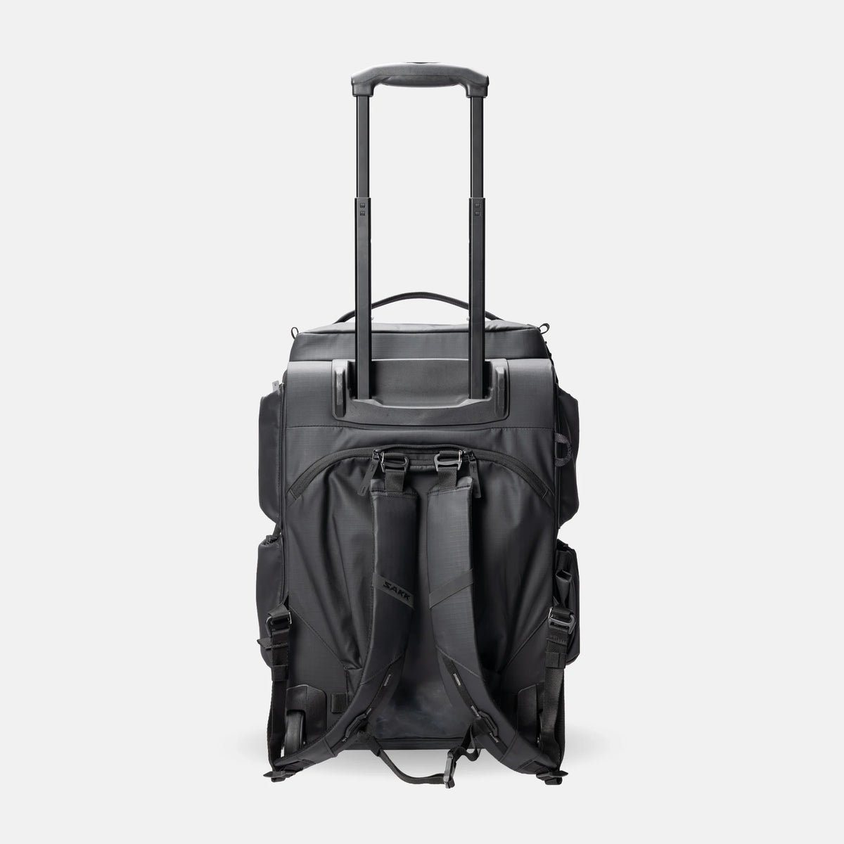 A black rolling duffel bag with an extended telescoping handle, shown from the back against a light gray studio background.