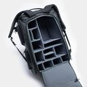 Open camera backpack with compartments on a white background