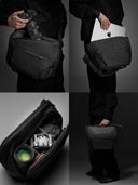 Black sling bag being used for carrying a camera, laptop, and camera equipment.