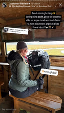 Social media story screenshot of a woman in winter gear using a Sakk Gear bag as support for her camera with telephoto lens in a bird hide; overlay text praises the bag for birding