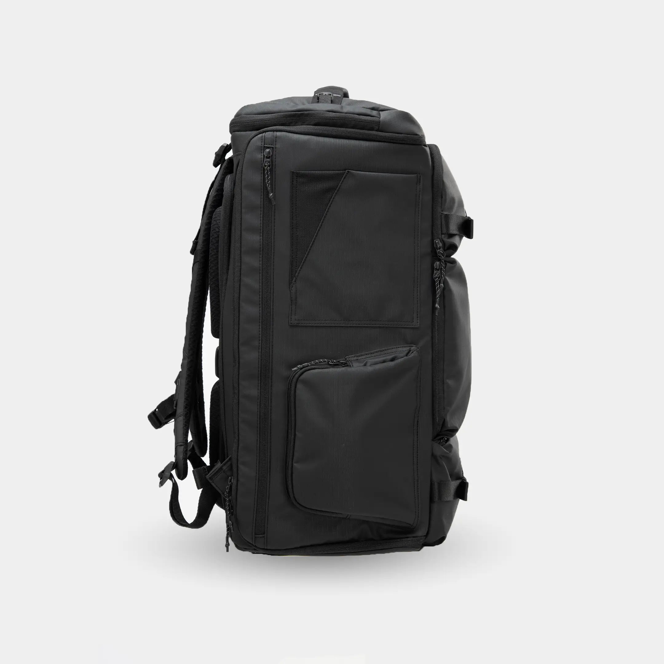Black backpack on a light gray background