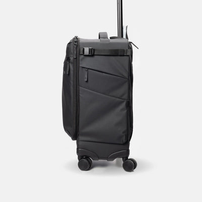 A black rolling suitcase with an extended telescoping handle, shown from a three-quarter angle against a light gray studio background.