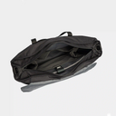 Tote bag for creators carrying laptop, iPad, camera, and personal items.