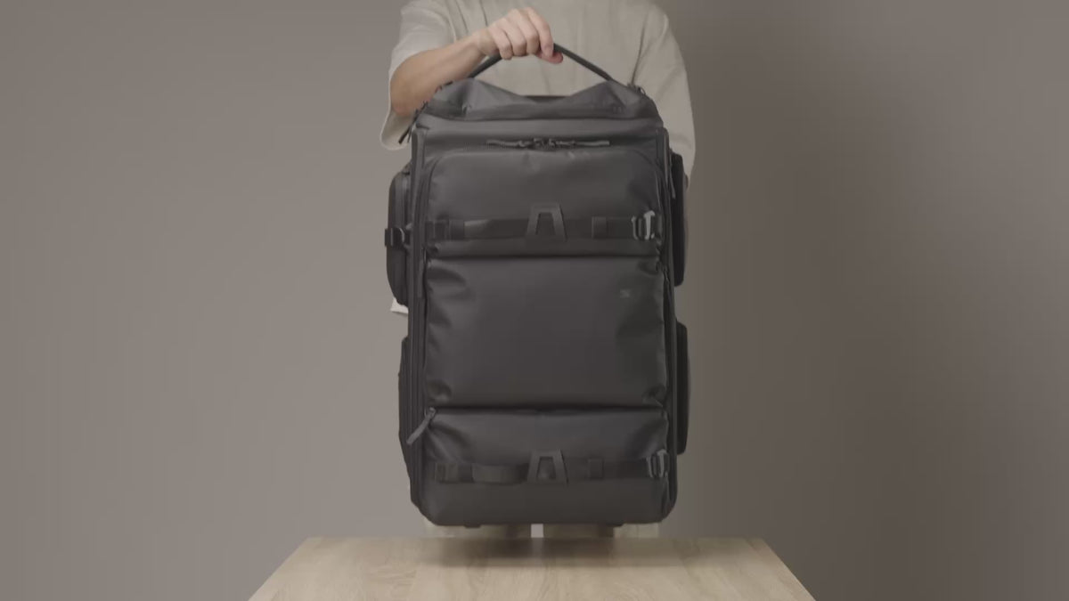 Load video: Video showcasing the Sakk Pack Cine Pro Roller packed with a cinema camera, multiple lenses, and filming accessories, demonstrating how everything fits neatly inside for organized storage and easy transport.